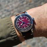Oris x Cervo Volante Big Crown Pointer Date Men’s Automatic 40mm Watch 754 7785 4038SET worn on the wrist, showing the burgundy dial and leather strap.