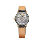 Rear-facing view of the Baume & Mercier Classima M0A10598, showing the transparent sapphire crystal case back revealing the automatic ETA 2892-A2 movement, framed by the polished 18K pink gold and titanium case.