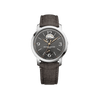Front-facing view of the Baume & Mercier Classima Special Edition M0A10718 men's watch, featuring a grey sun satin-finished dial with diagonal lines, open balance aperture at 12 o'clock, power reserve indicator at 6 o'clock, rose gold-tone leaf hands, Arabic numerals, polished stainless steel case, and a brown Holland & Sherry fabric strap.