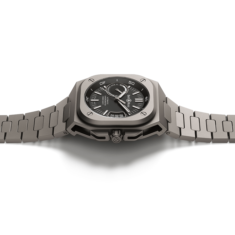 Bell & Ross BR-X5 Automatic 41mm Watch BRX5R-BL-TI/STI features a sapphire crystal case back showcasing the oscillating weight of the COSC-certified BR-CAL.323 movement. The exhibition case back is set within the microblasted titanium case.