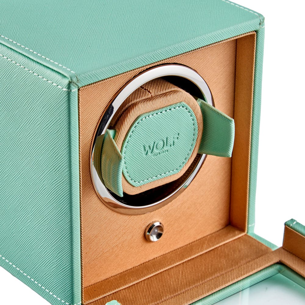 WOLF Cub Single Watch Winder with Cover in Mint, item 461125, showing its winding module up close. The patented lock-in cuff holds the watch securely in the rotator drum and suits all wrist sizes.