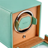 WOLF Cub Single Watch Winder with Cover in Mint, item 461125, showing its winding module up close. The patented lock-in cuff holds the watch securely in the rotator drum and suits all wrist sizes.