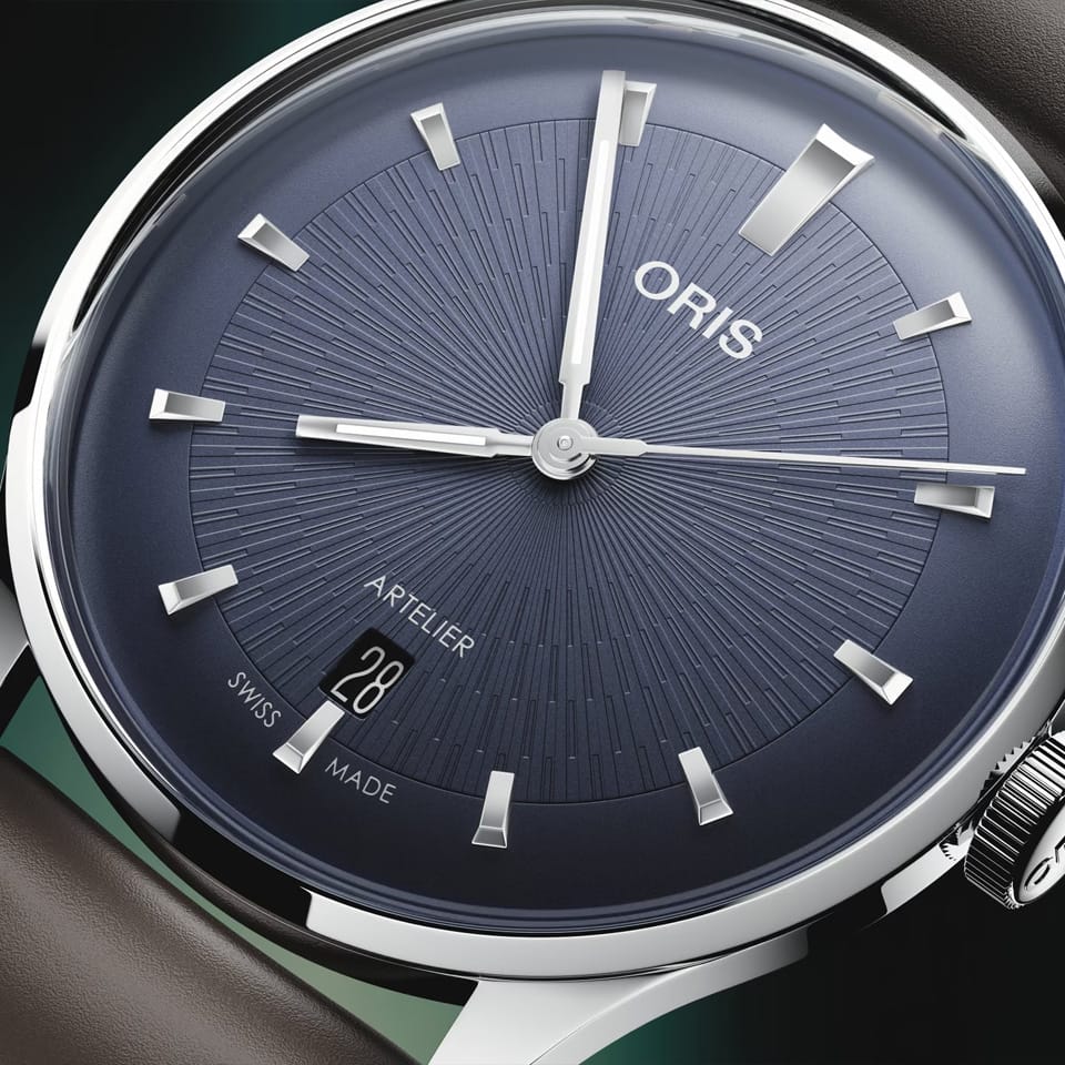 Oris Artelier Date Automatic 38mm Watch 01 733 7810 4055-07 6 20 17FC — A close-up shows the clean baton hour markers and date window against the blue dial's uncluttered surface.