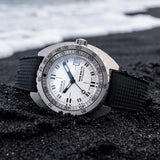 Side profile of DOXA SUB 300 Ti5 Whitepearl 42.5mm watch (Ref. 823.50.011.20) showing 13.4mm grade 5 titanium cushion case, screw-down crown, glass box sapphire crystal, and black rubber strap with folding clasp and wetsuit extension