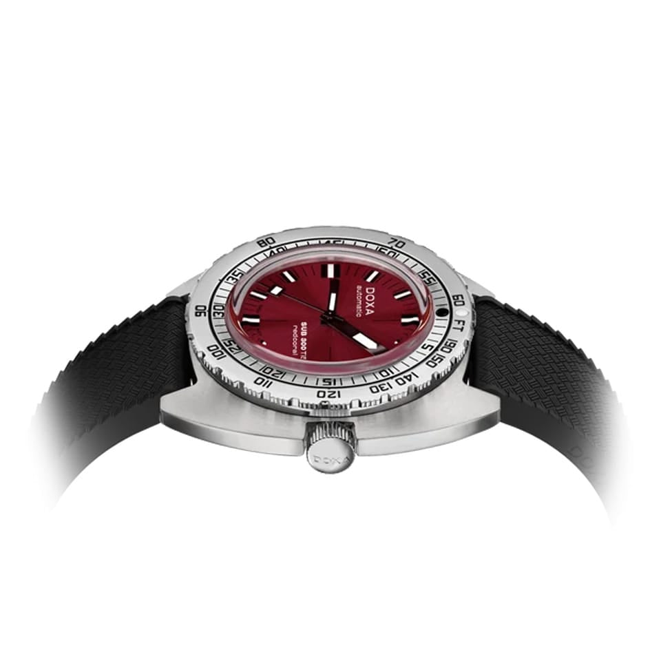 Side profile of DOXA SUB 300 Ti5 Redcoral 42.5mm watch (Ref. 823.50.161.20) showing 13.4mm grade 5 titanium cushion case, screw-down crown, glass box sapphire crystal, and black rubber strap with folding clasp and wetsuit extension