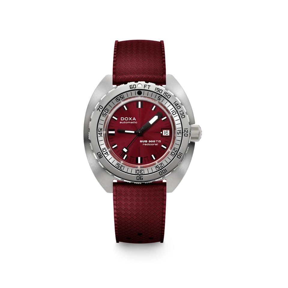 DOXA SUB 300 Ti5 Redcoral 42.5mm Watch (Ref. 823.50.161.22) — front view showing red coral dial, dual-scale unidirectional rotating bezel, date window at 3 o'clock, Super-LumiNova indices and hands, grade 5 titanium case, and colour-matched red rubber strap