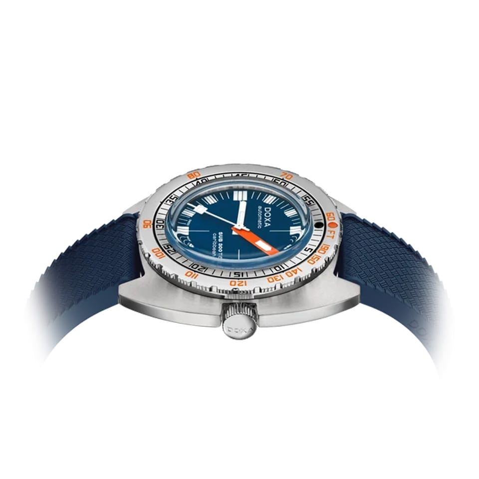 Side profile of DOXA SUB 300 Ti5 Caribbean 42.5mm watch (Ref. 823.50.201.32) showing 13.4mm grade 5 titanium cushion case, screw-down crown, glass box sapphire crystal, and colour-matched blue rubber strap with folding clasp and wetsuit extension