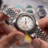 DOXA SUB 750T Searambler Automatic 45mm Watch 825.10.021.10 - close up of model showing luminous markers and hands
