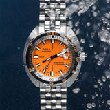 A DOXA SUB 1500T Professional Automatic 45mm Watch 883.10.351.10automatic watch with a vibrant orange dial and a silver stainless steel link bracelet, shown against a dark blue background with water droplets and bubbles.