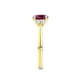 1.37 Carat Ruby and 0.40ct TW Diamond Trilogy Ring in 18ct Yellow Gold — This side profile highlights the ring's tapered gallery and the natural oval-cut diamonds set along the shoulders. The 18ct yellow gold band maintains a slim, elegant silhouette from every angle.