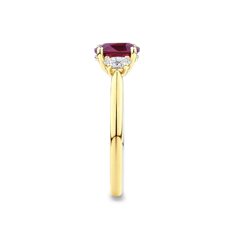1.37 Carat Ruby and 0.40ct TW Diamond Trilogy Ring in 18ct Yellow Gold — This side profile highlights the ring's tapered gallery and the natural oval-cut diamonds set along the shoulders. The 18ct yellow gold band maintains a slim, elegant silhouette from every angle.