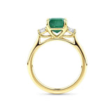 2.10 Carat Emerald and 0.40 Carat TW Diamond Trilogy Ring in 18ct Yellow Gold — Viewed from the front, the ring showcases its trilogy design with the emerald-cut emerald set above matching emerald-cut diamonds on either side. The 18ct yellow gold setting frames the stones in a warm, classic tone.