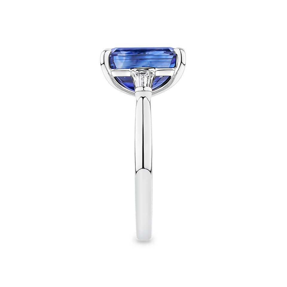 4.05 Carat Sapphire and 0.18 TW Carat Diamond Trilogy Ring in 18ct White Gold — This side profile highlights the ring's tapered gallery and the tapered baguette diamonds set along each shoulder. The 18ct white gold band maintains a slim, elegant silhouette from every angle.