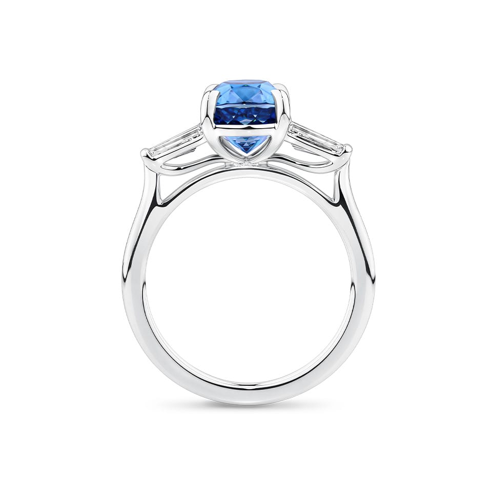 4.62 Carat Zircon and 0.36 Carat TW Diamond Trilogy Ring in 18ct White Gold — Viewed from the front, the ring showcases its trilogy design with the cushion-cut zircon set above tapered baguette diamonds on either side. The 18ct white gold setting frames the stones in a bright, cool tone.
