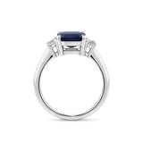 3.68 Carat Sapphire and 0.42 Carat TW Diamond Trilogy Ring in 18ct White Gold — Viewed from the front, the ring showcases its trilogy design with the emerald-cut sapphire set above matching emerald-cut diamonds on either side. The 18ct white gold setting frames the stones in a bright, cool tone.
