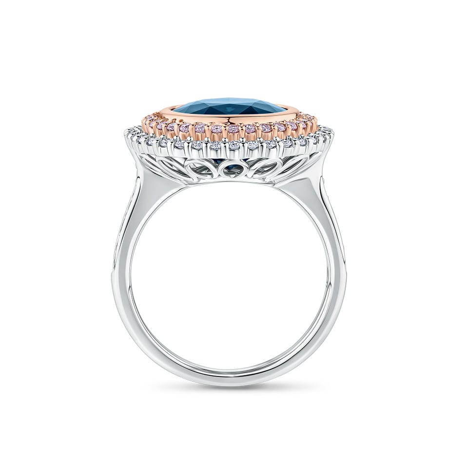 7.66 Carat Sapphire and 1.04 Carat TW Diamond Halo Ring in 18ct Rose and White Gold — Viewed from the front, the ring showcases its double halo design with the cushion-cut sapphire framed by rose gold-set pink diamonds and an outer white gold-set diamond halo. The two-tone setting creates a striking contrast.