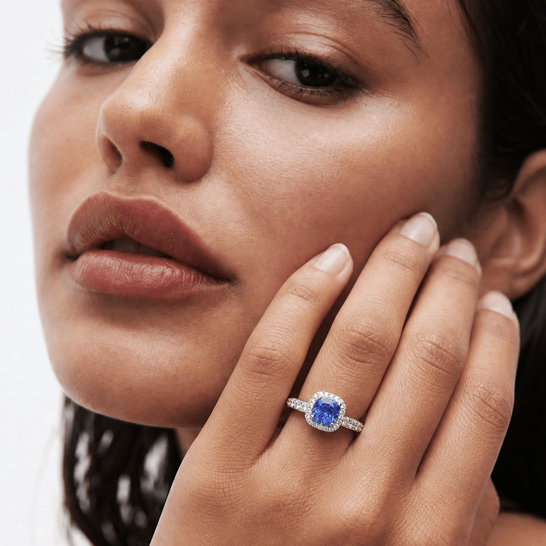 Tanzanite Cushion and Diamond Halo Ring in 18ct White Gold