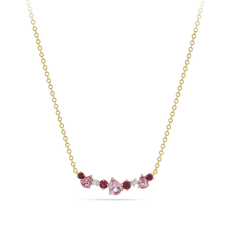 Close-up detail of the Elysian Diamond, Ruby and Tourmaline Cluster Necklace in 18ct yellow gold by Hardy Brothers, highlighting the pink tourmaline, ruby and diamond cluster.