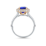 Close-up of the diamond halo setting on the VAULT® Sapphire and Diamond Halo Ring by Hardy Brothers, highlighting the rose gold grain setting around the cushion cut sapphire.