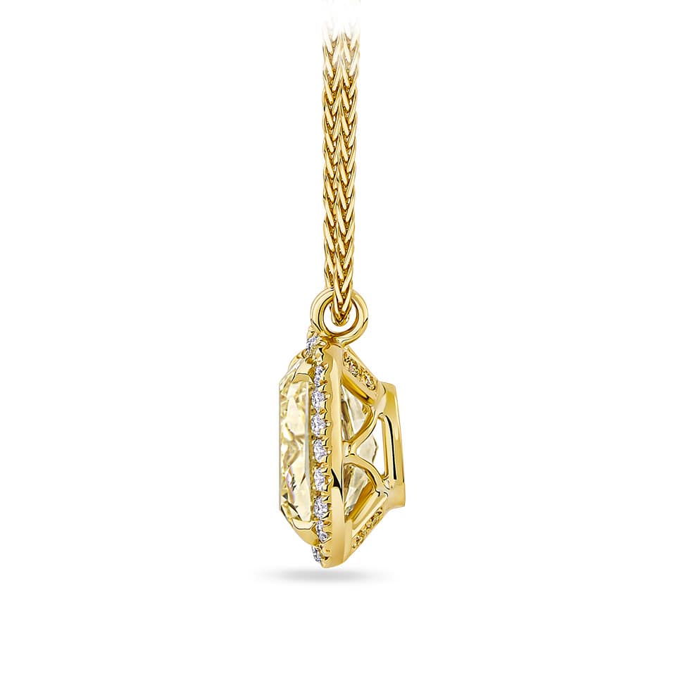 3.01 Carat Fancy Yellow Diamond and 0.28 Carat TW Diamond Pendant in 18ct Yellow Gold — This close-up highlights the cushion-cut fancy yellow diamond's warm, golden hue and the surrounding halo of natural round diamonds. The 18ct yellow gold setting frames the centre stone with a bright, crisp contrast.