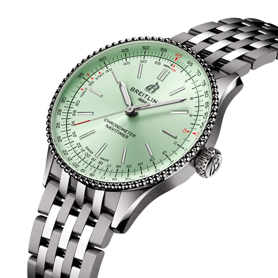 Breitling Navitimer Automatic 36mm Watch A17327361L1A1 shows the cambered sapphire crystal and beaded bezel detail from an angled perspective. The stainless steel bracelet connects seamlessly to the 36mm case.
