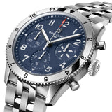 Breitling Classic AVI Automatic Chronograph 42mm Watch A233801A1C1A1 shows the bidirectional ratcheted bezel and cambered sapphire crystal from an angled perspective. The stainless steel bracelet connects seamlessly to the 42mm case.
