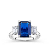 4.27 Carat Emerald Cut Sapphire and 0.80 Carat Emerald Cut Diamond Trilogy Ring in 18ct White Gold