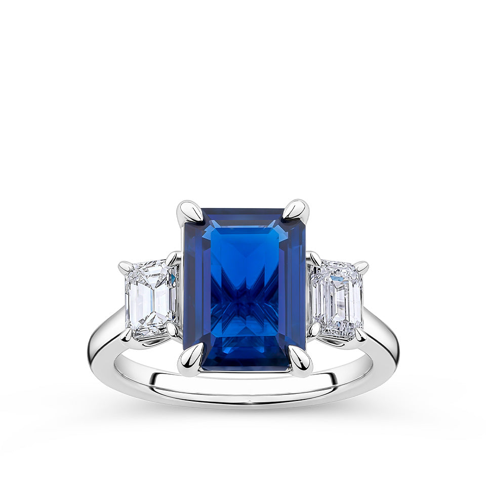 4.27 Carat Emerald Cut Sapphire and 0.80 Carat Emerald Cut Diamond Trilogy Ring in 18ct White Gold