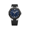 Front-facing view of the Baume & Mercier Riviera M0A10768 men's watch, featuring a dark blue lacquered dial with tone-on-tone wave pattern, Roman numerals and indexes with white SuperLuminova, rhodium-plated obelisk-style hands, date window at 3 o'clock, polished stainless steel case with sandblasted ADLC-coated twelve-sided bezel secured with four screws, and an interchangeable black rubber strap with canvas pattern.