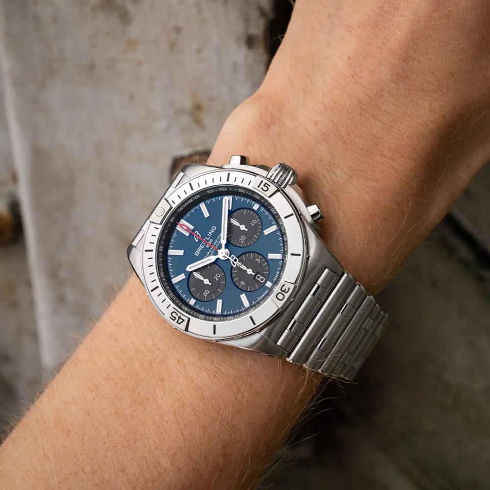 Breitling Chronomat B01 Chronograph 42mm Watch AB0134101C1A1 is shown worn on the wrist, highlighting the proportions of its 42mm case and Rouleaux bracelet. This COSC-certified chronograph is powered by the Breitling Manufacture Caliber 01 with an approximate 70-hour power reserve.