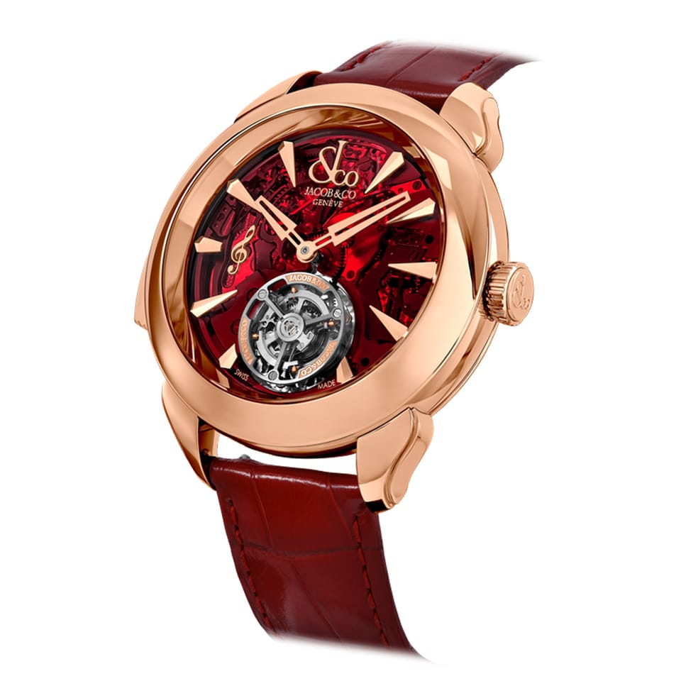 Three-quarter angle view of the Jacob & Co. Palatial Flying Tourbillon Minute Repeater 18K Rose Gold Manual 43mm Watch, reference PT500.40.NS.AC.A, capturing the sculpted lugs and the depth of the sapphire crystal. The red mineral crystal dial reveals the repeater mechanism beneath from this angle.
