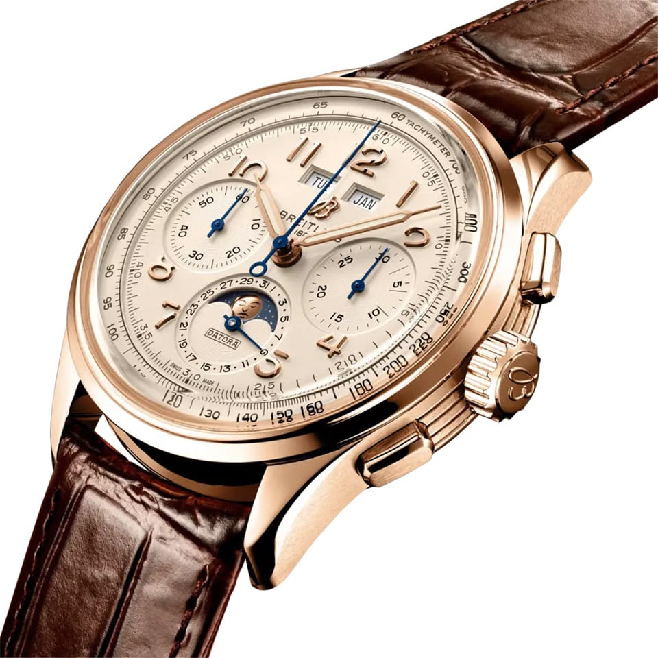 Breitling Premier B25 Datora 42mm Watch RB2510371G1P1 shows the grooved case-sides and cambered sapphire crystal from an angled perspective. The brown alligator strap curves into the 42mm 18k red gold case for a refined silhouette.