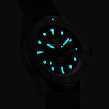 Bremont Supermarine Full Ceramic Deep Blue Automatic Men’s 43mm Watch SM43-DT-BLCER-BK-L-S showing its lume in low light. The indexes and hands glow blue from their Super-LumiNova fill.