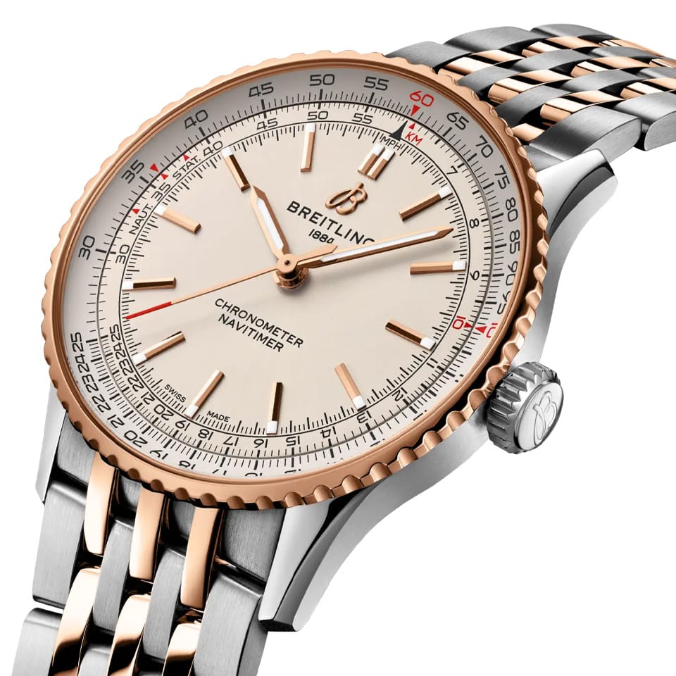 Breitling Navitimer Automatic 41mm Watch U17329F41G1U1 shows the alternating polished and brushed finishes from an angled perspective. The stainless steel and 18k red gold bracelet connects seamlessly to the 41mm case.