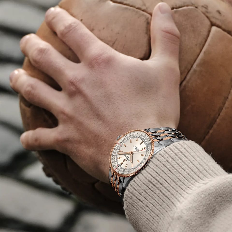 Breitling Navitimer Automatic 41mm Watch U17329F41G1U1 is shown worn on the wrist, highlighting the proportions of its 41mm case and two-tone bracelet. This automatic timepiece is powered by the Breitling Caliber 17 with an approximate 38-hour power reserve.