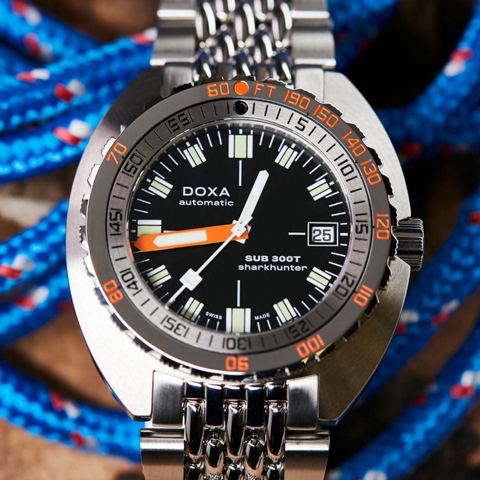 DOXA SUB 300T Sharkhunter Automatic 42.50mm Watch 840.10.101.10 - lifestyle show showing the orange accented dial