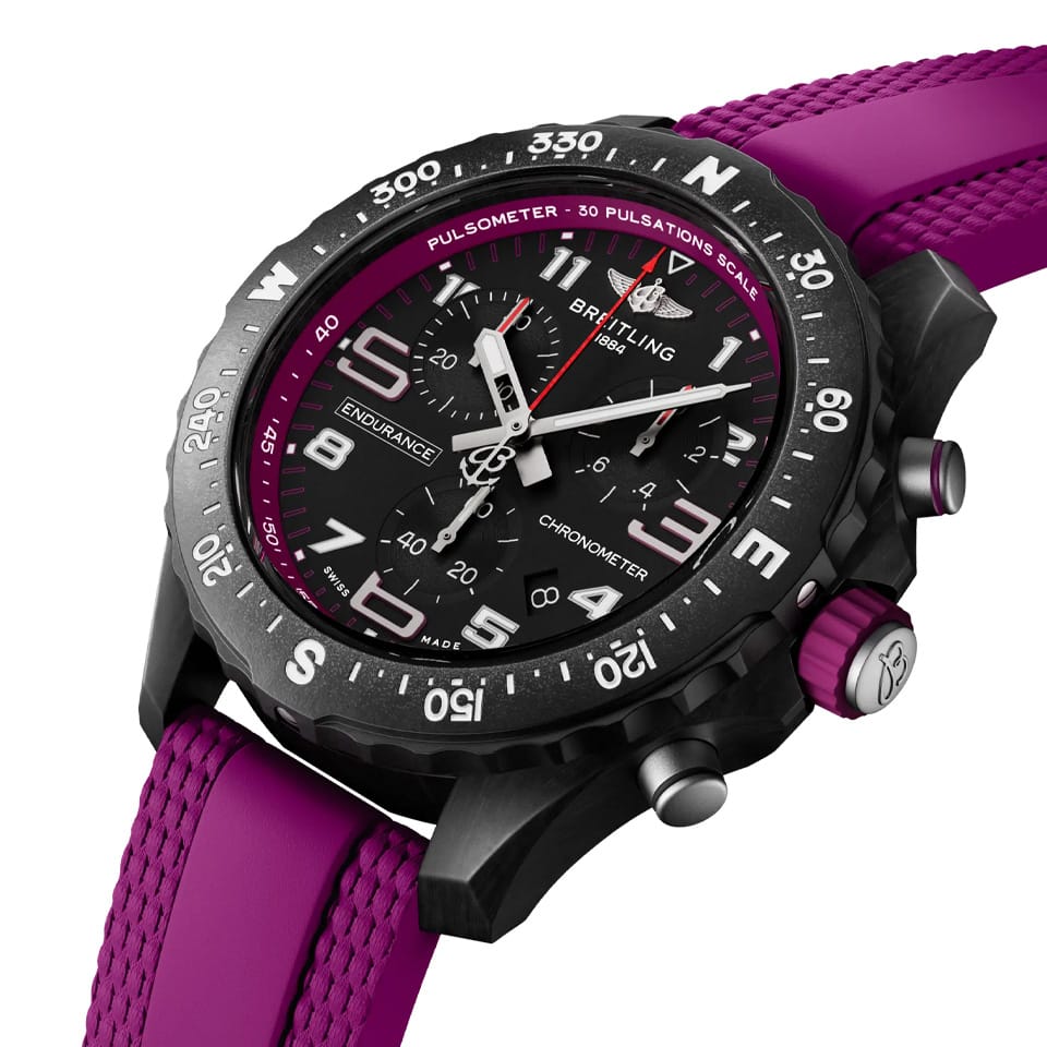Breitling Endurance Pro Quartz Chronograph 38mm Watch X83310F61B1S1 shows the sapphire crystal and textured Breitlight® finish from an angled perspective. The purple rubber strap curves into the 38mm case for an athletic, everyday-wear profile.