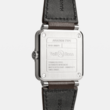 Bell & Ross BR-03 Automatic 41mm Men's Watch, reference BR03A-GB-ST/SCA, showing the back of the brown calfskin leather strap and satin-polished steel pin buckle. An additional black synthetic canvas fabric strap is included with the watch.