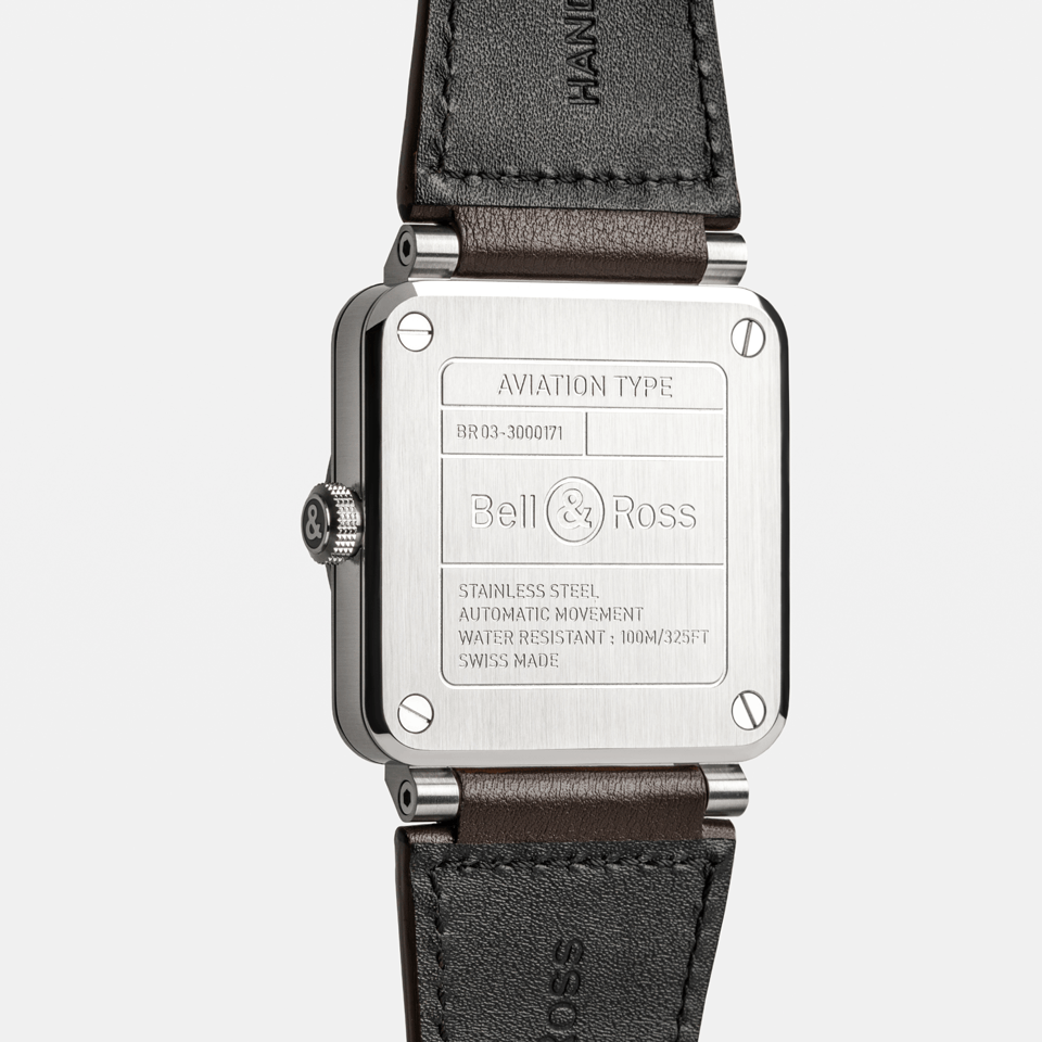 Bell & Ross BR-03 Automatic 41mm Men's Watch, reference BR03A-GB-ST/SCA, showing the back of the brown calfskin leather strap and satin-polished steel pin buckle. An additional black synthetic canvas fabric strap is included with the watch.