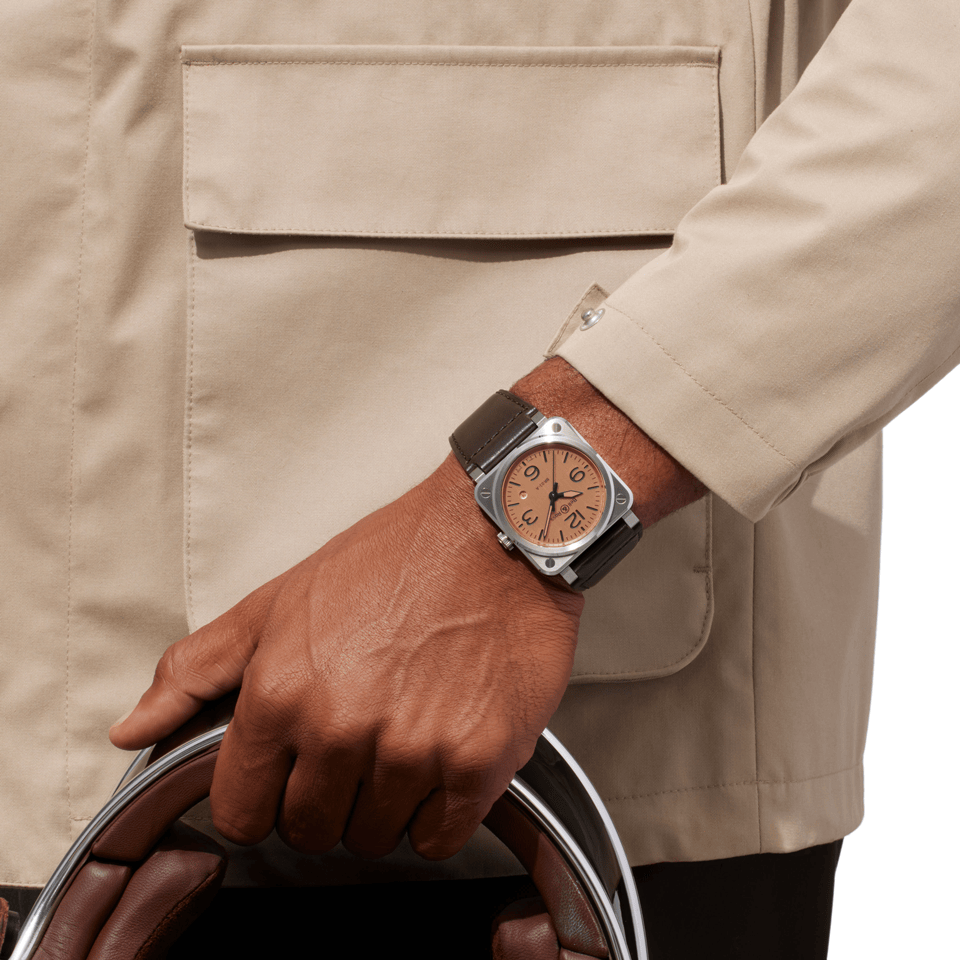 Bell & Ross BR-03 Automatic 41mm Men's Watch, reference BR03A-GB-ST/SCA, worn on the wrist to demonstrate the true-to-scale 41mm square case. The copper dial and brown leather strap give the watch a warm, distinctive presence.