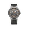 Front-facing view of the Baume & Mercier Riviera M0A10660 men's watch, featuring a slate-grey lacquered dial with tone-on-tone wave pattern, rose gold-tone obelisk-style hands and luminescent indexes, Roman numerals at 6 and 12 o'clock, date window at 3 o'clock, polished dodecagonal stainless steel case with sandblasted titanium bezel, gold-plated PVD ring accent, and a grey textured rubber strap.