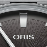 Oris Artelier Date Automatic 38mm Watch 01 733 7810 4054-07 8 20 20 — A close-up shows the clean baton hour markers and date window against the black dial's uncluttered surface.