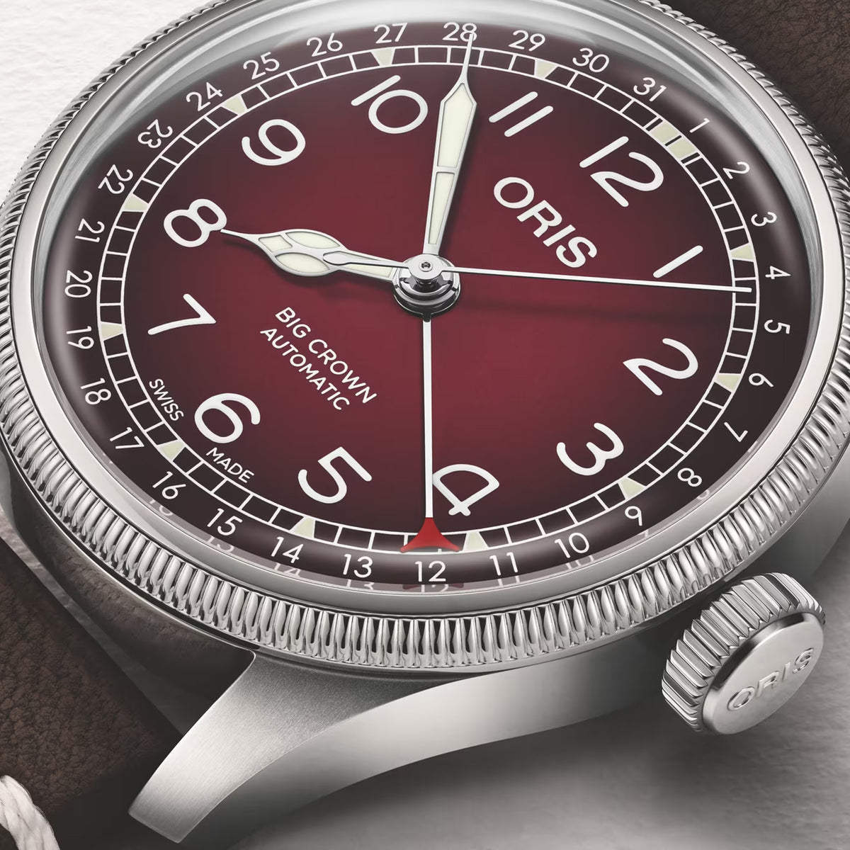 Oris x Cervo Volante Big Crown Pointer Date Men’s Automatic 40mm Watch 754 7785 4038SET, close up of the burgundy dial, Arabic numerals and pointer date hand.