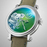 Side profile of the Speake Marin Art Series Koala Automatic 42mm Watch 414217420, showing the Grade 5 titanium Piccadilly case and crown. The green recycled nylon strap, lined in brown corn-based leather, attaches neatly to the case.