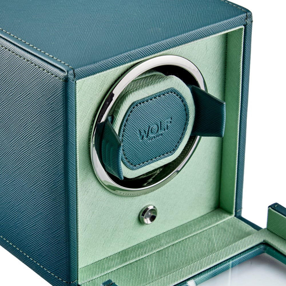 WOLF Cub Single Watch Winder with Cover in Teal, item 461140, showing its winding module up close. The patented lock-in cuff holds the watch securely in the rotator drum and suits all wrist sizes.