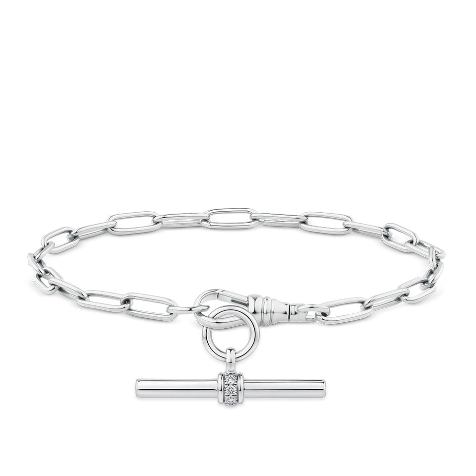 Paperclip Bracelet in sterling silver from Hardy Brothers Jewellers, styled with a T-bar pendant (sold separately) hanging below the bracelet in a matching silver tone.