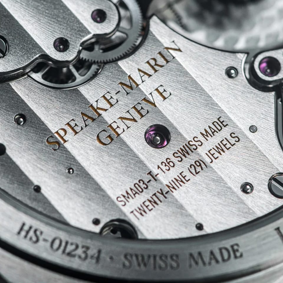 Sapphire case back of the Speake Marin Ripples Black Original Automatic 40.30mm Watch 604015040, revealing the in-house SMA03-T calibre with fully integrated micro-rotor. Hand-finished, rhodium-plated bridges are decorated with Geneva stripes and refined inner angles.