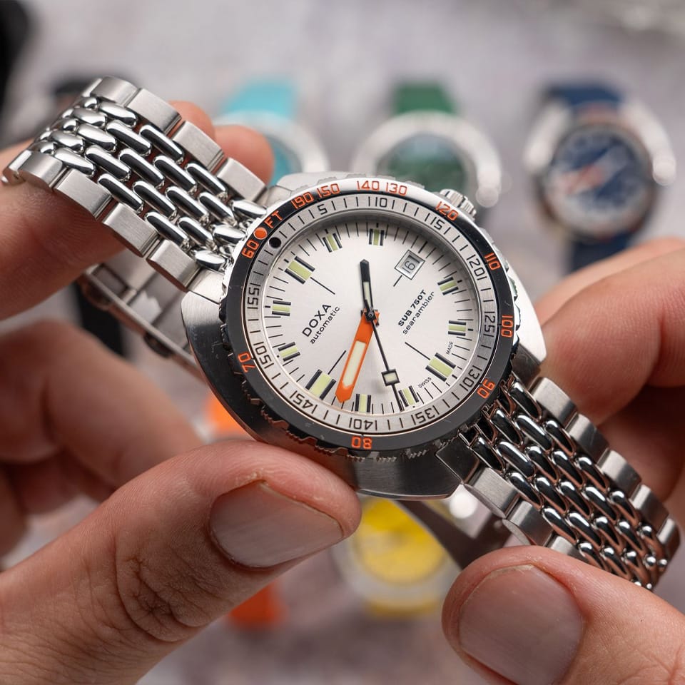 DOXA SUB 750T Searambler Automatic 45mm Watch 825.10.021.10 - close up of model showing luminous markers and hands