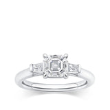 0.96 Carat Asscher Cut Diamond and Tapered Baguette Trilogy Ring in 18ct white gold from Hardy Brothers Jewellers, shown front-on with the Asscher cut centre diamond and tapered baguette side stones.