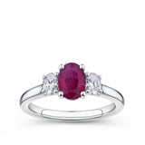 1.15 Carat Burmese Ruby and 0.40ct TW Diamond Ring in 18ct White Gold — A vivid, GWLab-certified oval-cut Burmese ruby takes centre stage, flanked by two natural oval-cut diamonds of G-H colour and VS-SI clarity. 